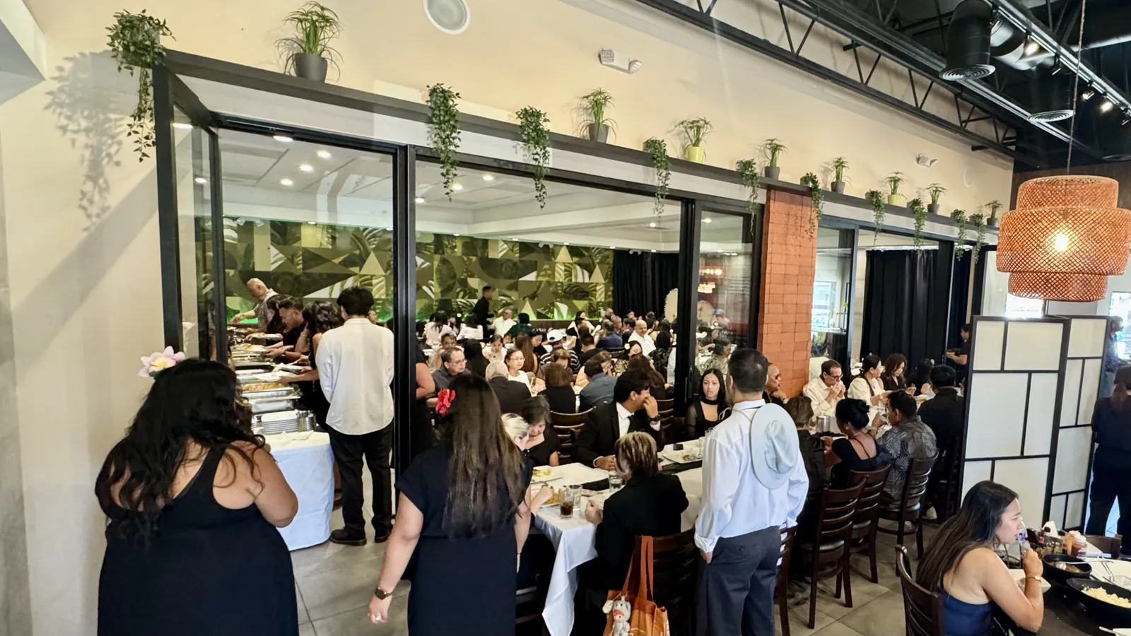 A buffet line being set for a large celebration in the Max's San Diego dining room
